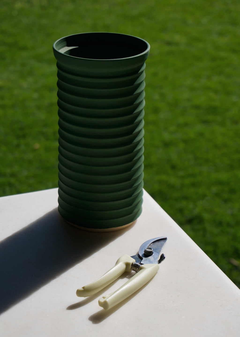 Naeos handmade stoneware column vase styled with dried stems